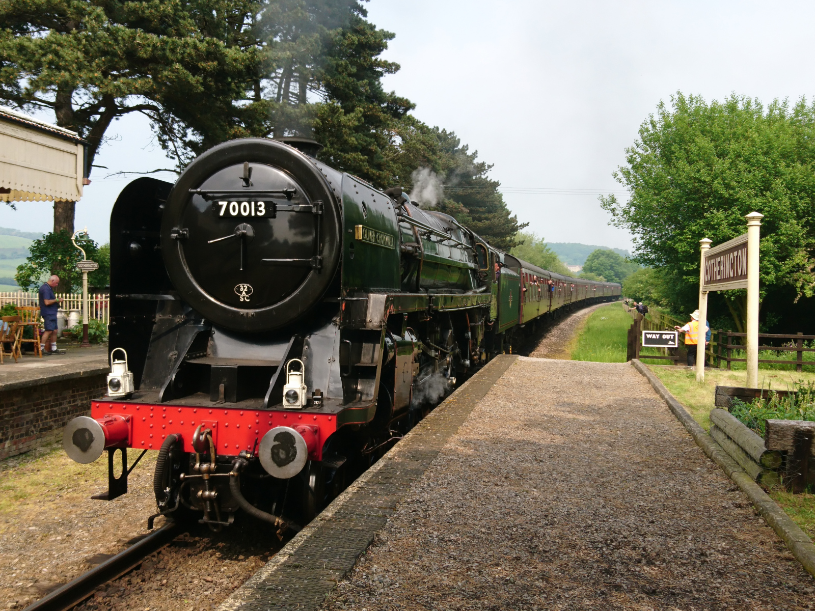 A steam train stopped at Gotherington station