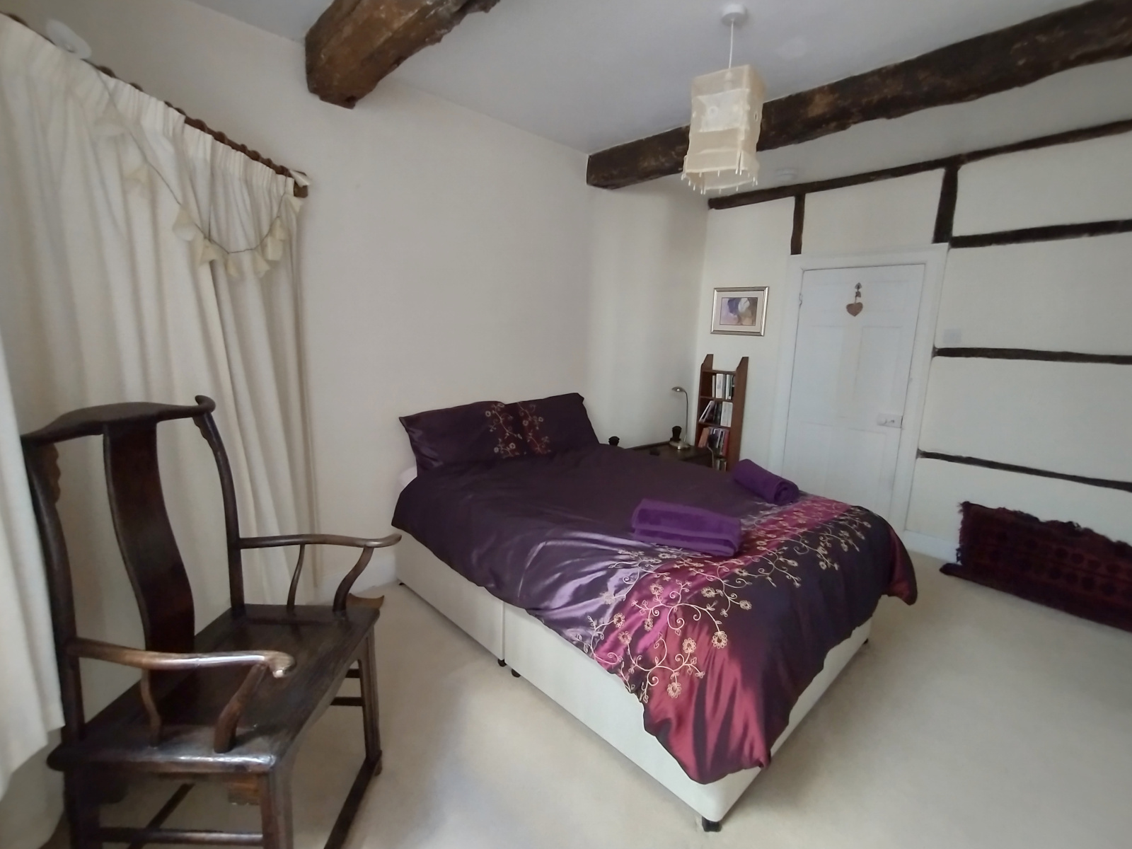 Cosy and characterful bedroom with beams